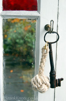 Monkey Fist knot keyring in cotton rope on hook