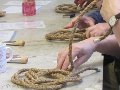 Day workshop at The Workshop for the Would-Be Creative in 2014: participants at different stages of making Turk's Head thump mats from manila cord