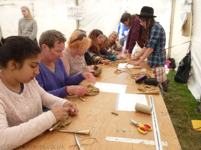 Making Turks Head mats and baskets at a drop-in knot craft session, HesFes 2015