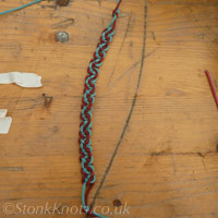 Finished Double Carrick Bend bracelet in blue and brown cotton cord.