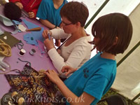 Making clothes for rope dolls, Wychwood 2012